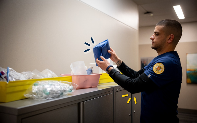 Josh restocking supplies at the clinic.
